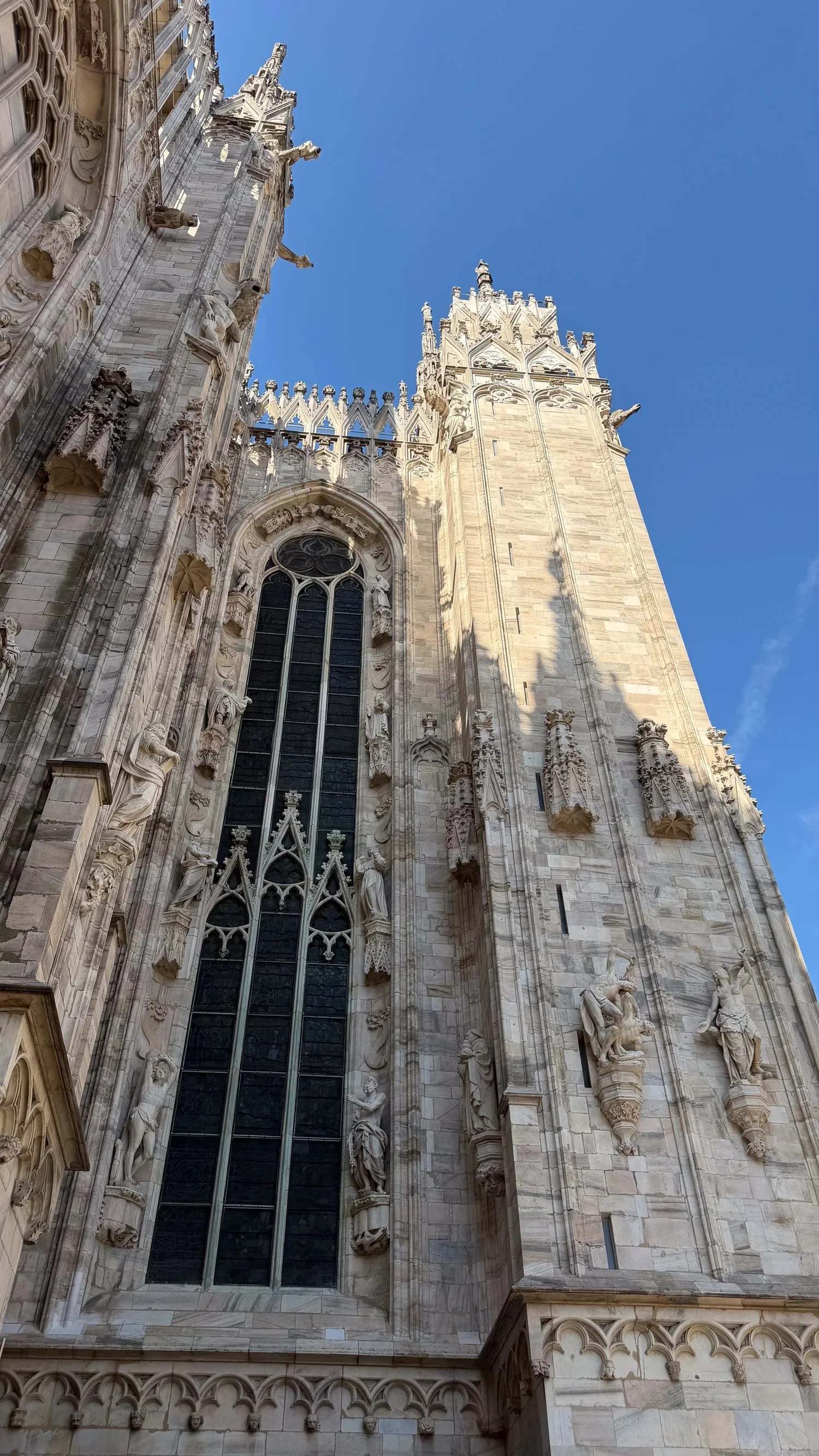Carved Gothic stonework and spires on Milan Cathedral.