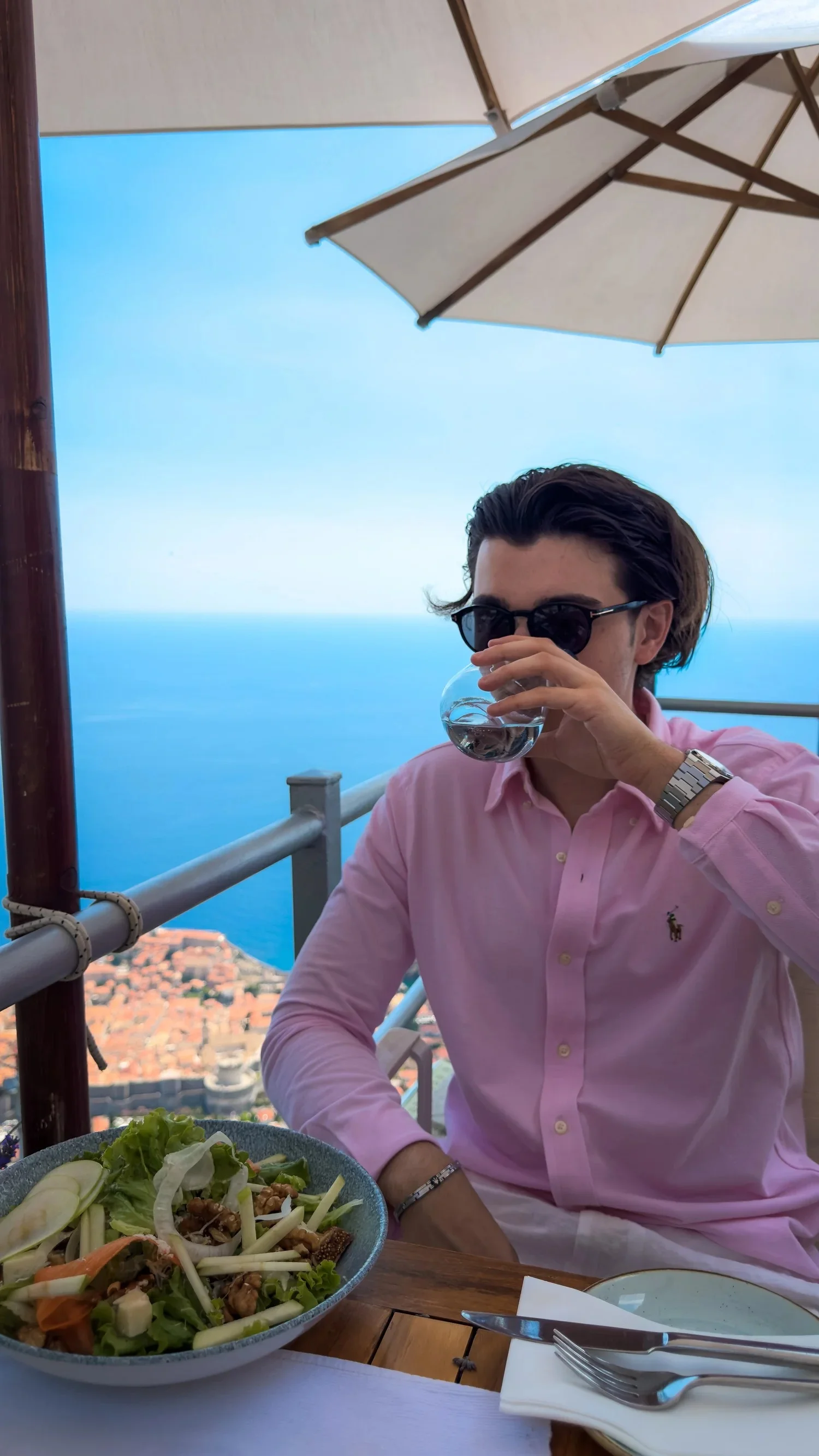 A diner in a pink shirt at Panorama Restaurant overlooking Dubrovnik