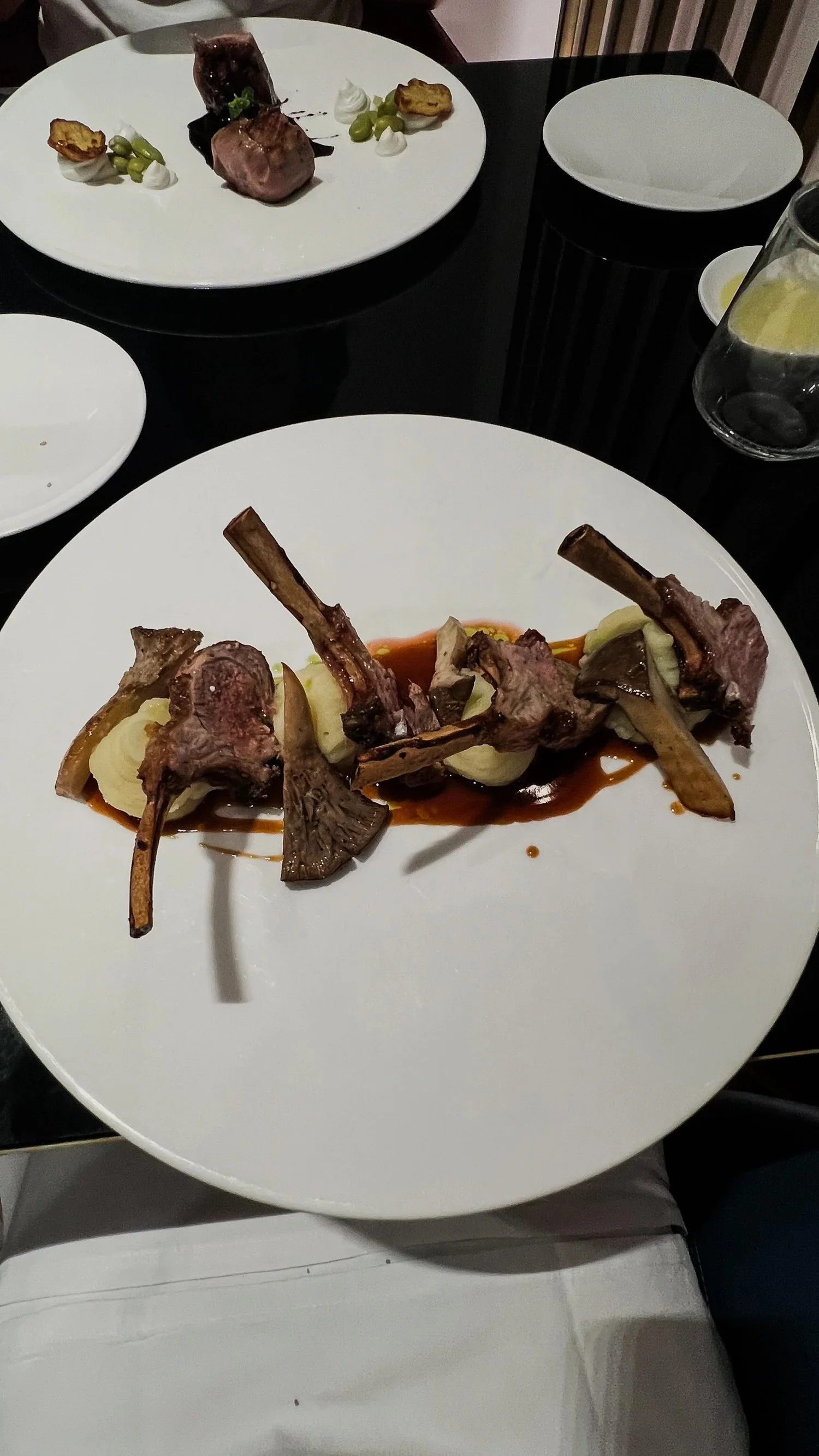 Grilled lamb chops served with mashed potato, cardoncello mushrooms and sauce at CR21 in Palermo.
