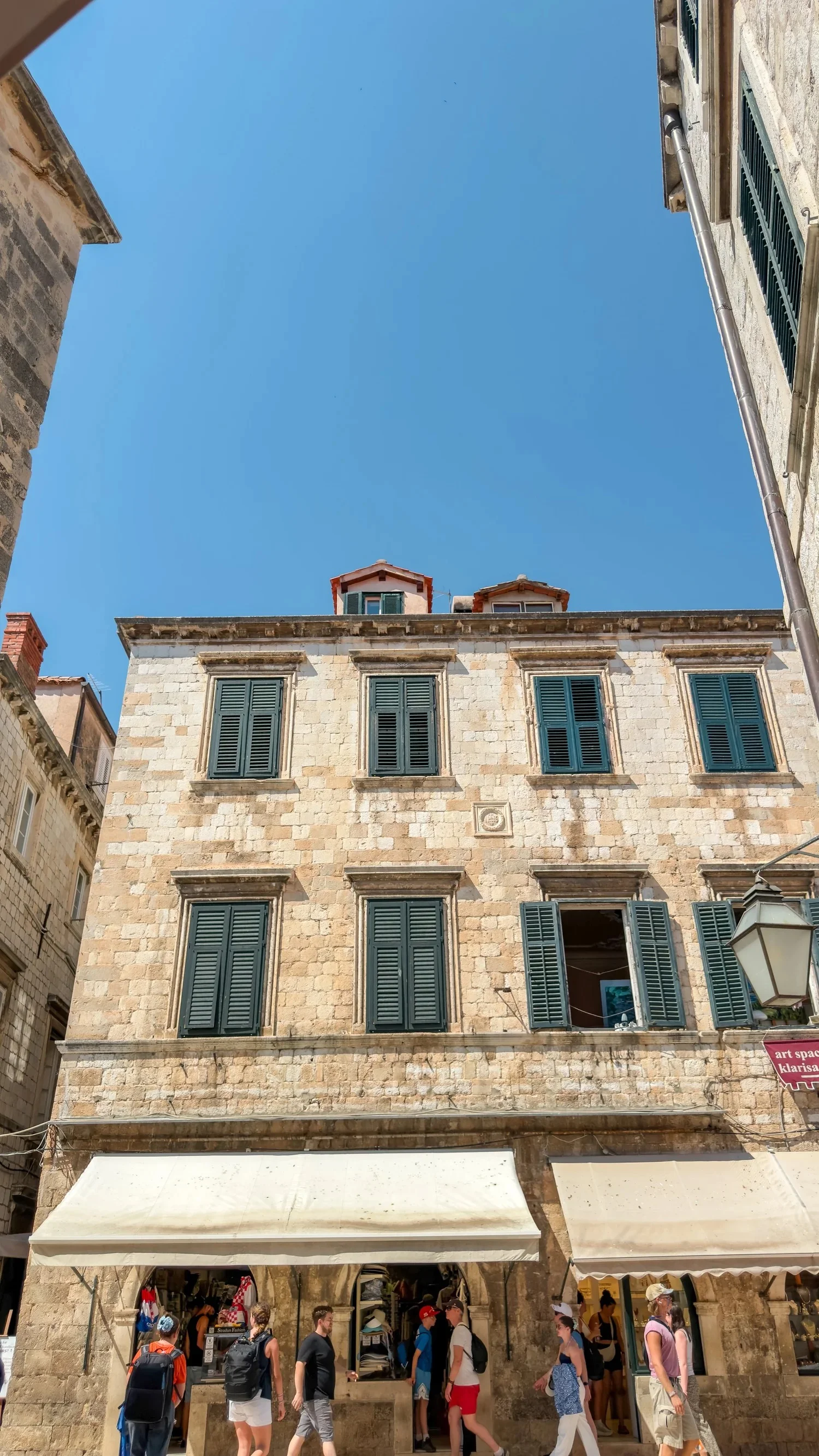 Historic stone buildings beside Fish Restaurant Proto in Dubrovnik Old Town