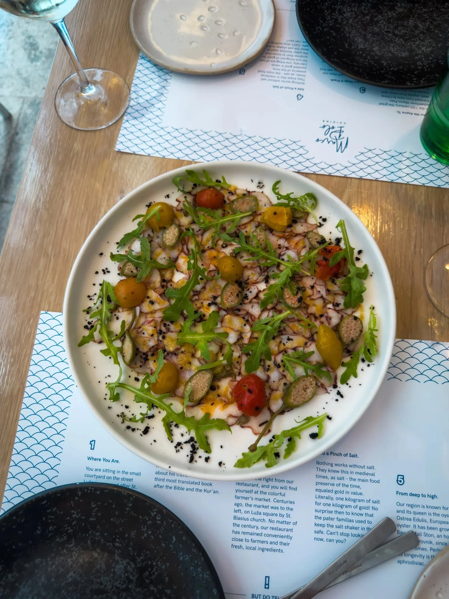 Octopus carpaccio with herbs at Restaurant Marco Polo