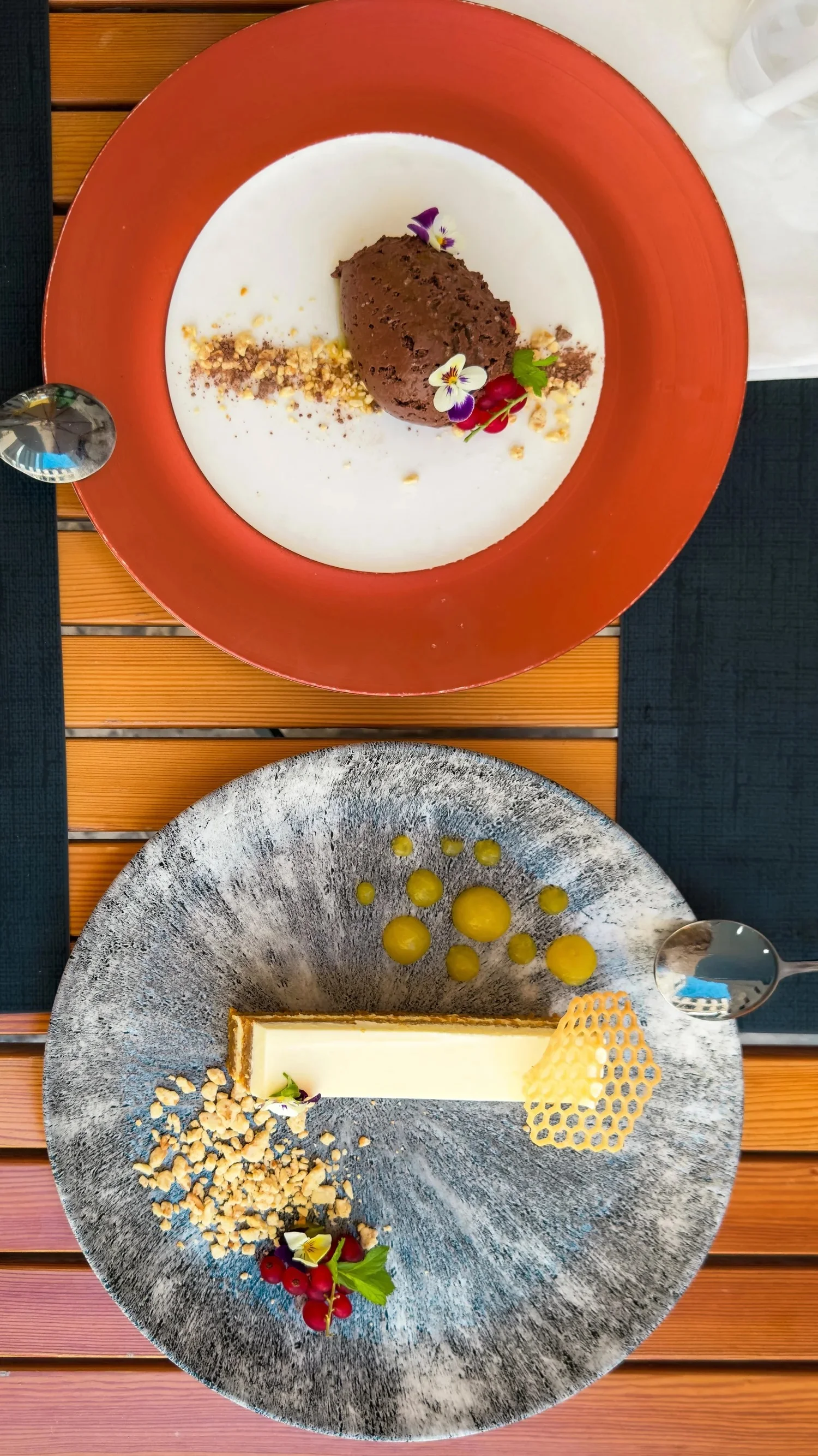 Desserts served on colourful plates at Fish Restaurant Proto